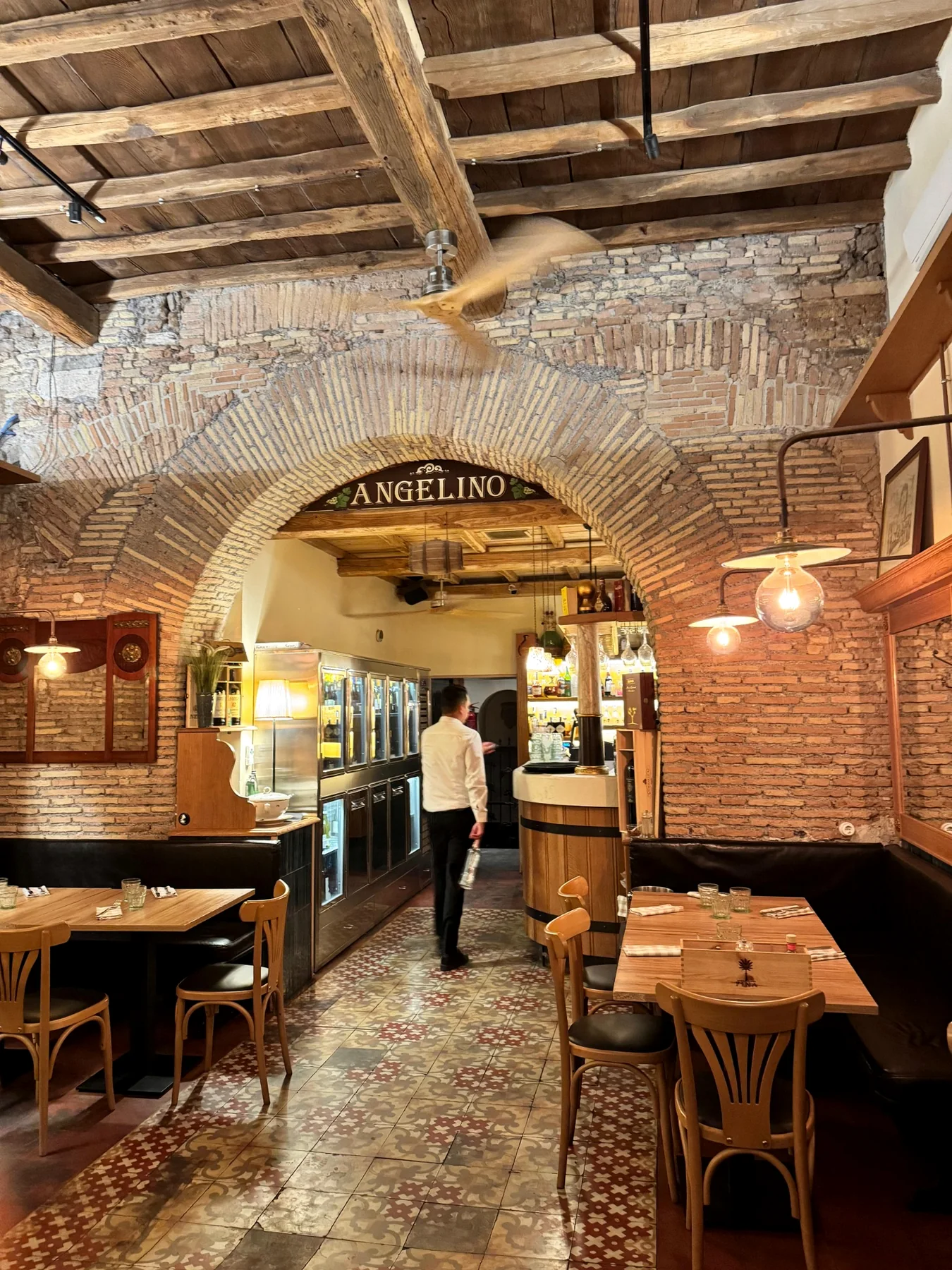 Dining room with tables and brick arches